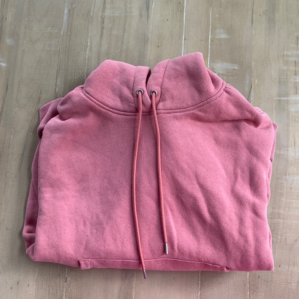 Slightly cropped pinkish red sweatshirt